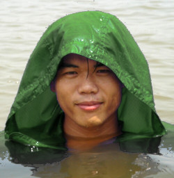 wet green anorak in lake